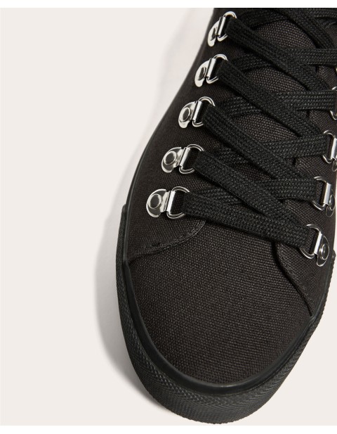 BLACK PLIMSOLLS WITH EYELETS DETAIL